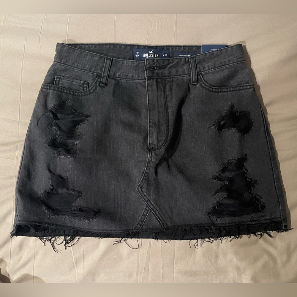 Hollister black jean skirt size 11, never worn. Tags still on it.